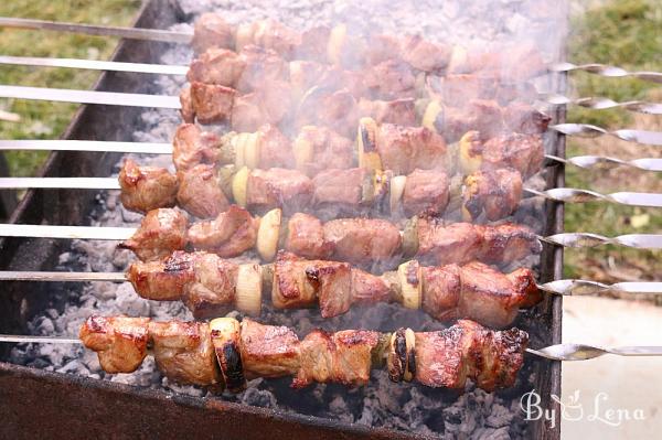 Grilling Marinated Shashlik On A Grill. Shashlik Is A Form Of Shish Kebab  Popular In Eastern, Central Europe And Other Places. Shashlyk (meaning  Skewered Meat) Was Originally Made Of Lamb. Royalty Free